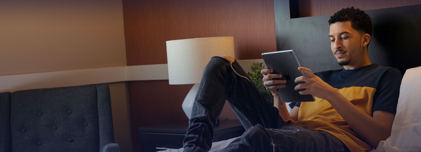 Patient at Sunrise Detox Fort Lauderdale  reading on his bed