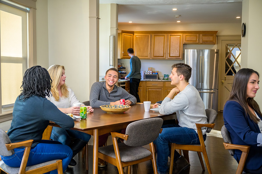 a group of patients at a dining table